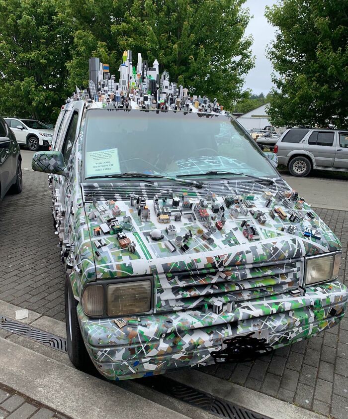 Decorated car with miniature cityscape, an example of creative car-fails.