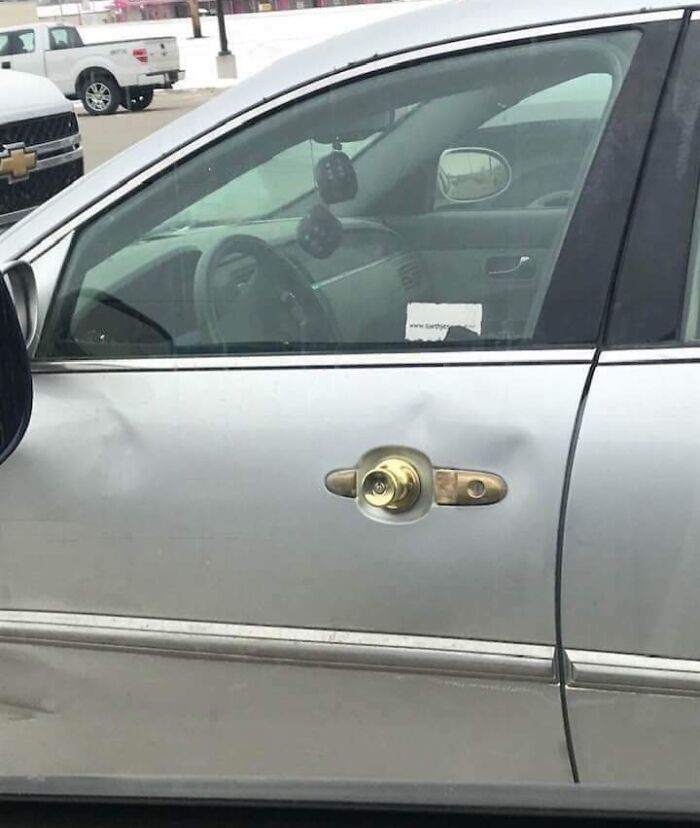 Car door with a house doorknob installed as a makeshift handle, exemplifying car-fails creativity.