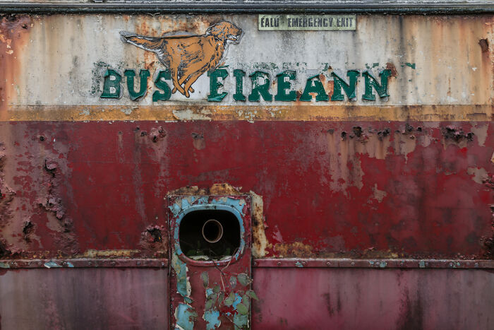 Rusty Bus Éireann exterior in Irish ghost bus graveyard.