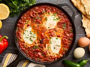 Overhead view of shakshuka in a cast iron skillet.