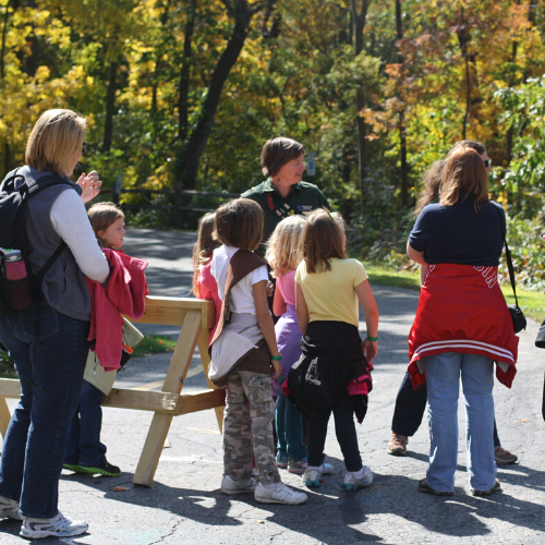 Photo of tour guide with scouting troop of kids at a Wisconsin Destination