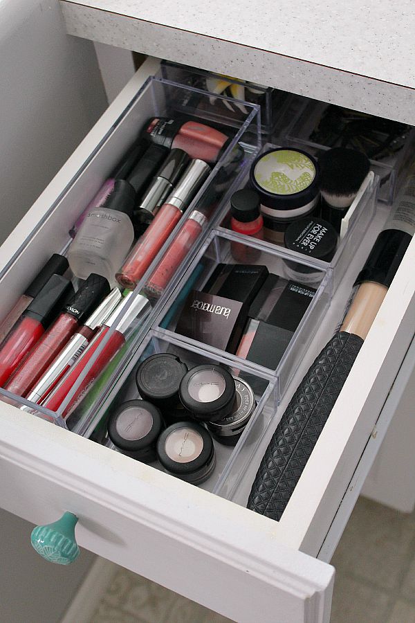 Make-up drawer organized with clear acrylic organizers.