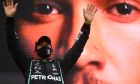 Mercedes driver Lewis Hamilton of Britain celebrates after winning the Formula One Portuguese Grand Prix at the Algarve International Circuit in Portimao, Portugal, Sunday, Oct. 25, 2020. (Rudy Carezzevoli, Pool via AP)