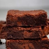 stacked brownies with chocolate chips baked in on the inside.