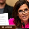 Congresswoman Nancy Mace in a pink top and glasses holding up a piece of paper and talking to a witness at a House hearing