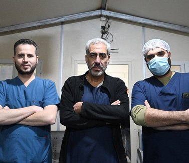 Left to right: Dr Husam Abob Alward, Dr Naser El Yousef and Dr Fares Al Shadidy, who work at the Bab al Salama Surgical Hospital. Photo credit: WHO/Mrinalini Santhanam