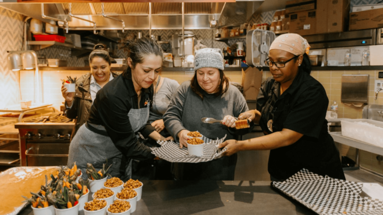 Female chefs preparing food at an event