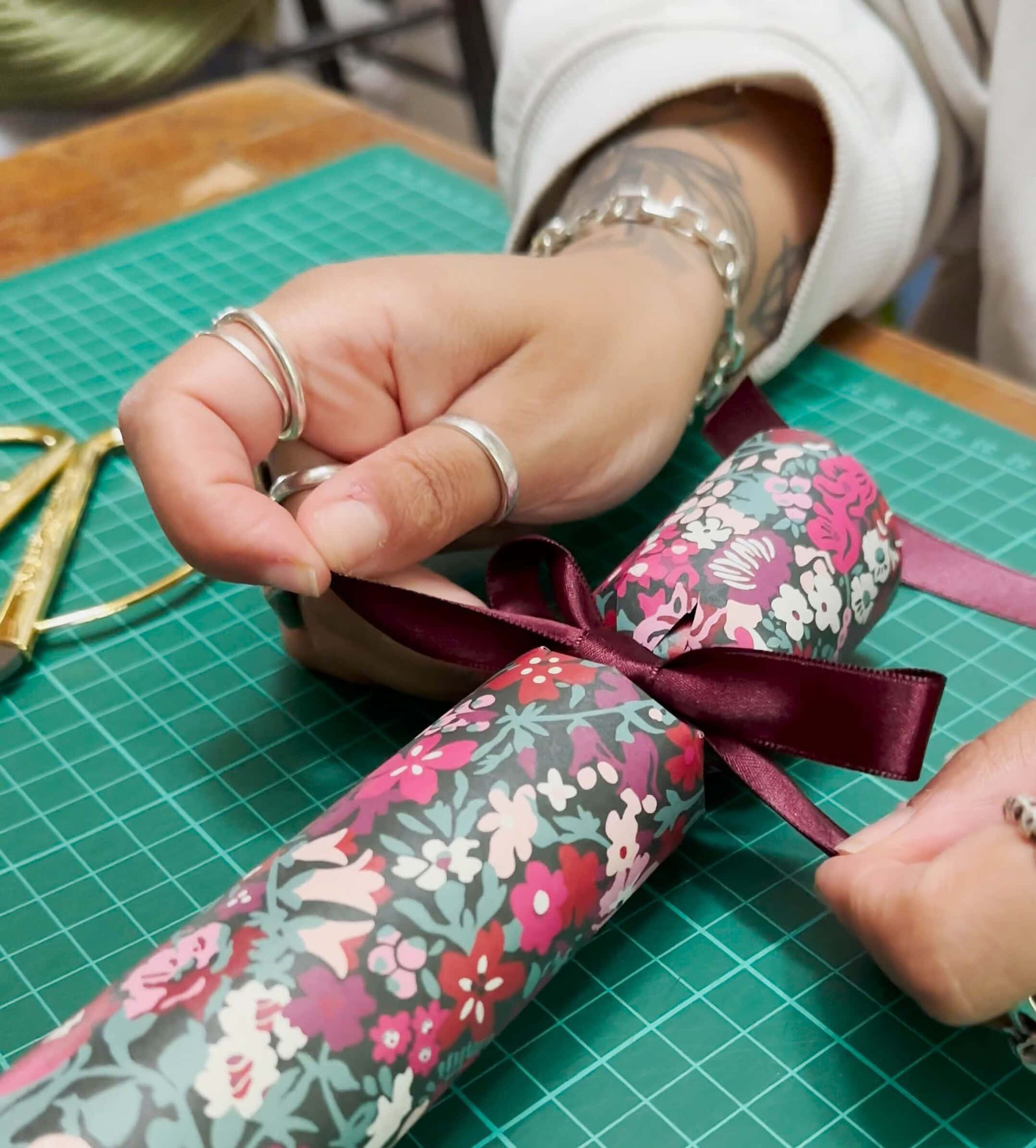 add the ribbon to the christmas cracker for the finishing decorative touch