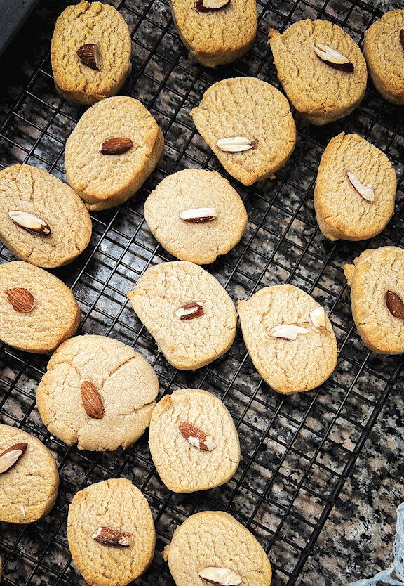 Almond cookies just out of the oven and on a wire rack