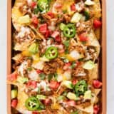 bbq pork nachos on pan