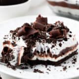 Oreo chocolate lasagna on a white plate.