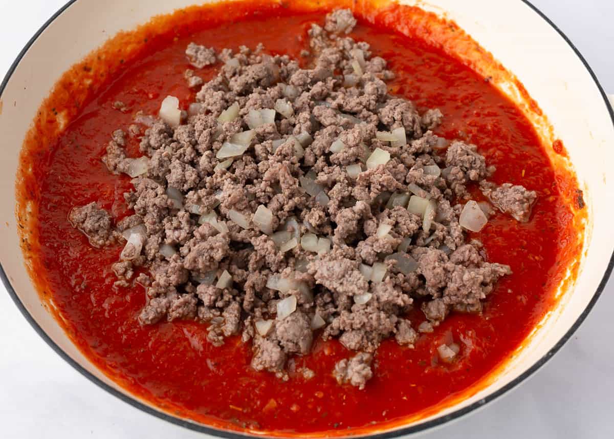 Ground beef mixed in with tomato sauce.