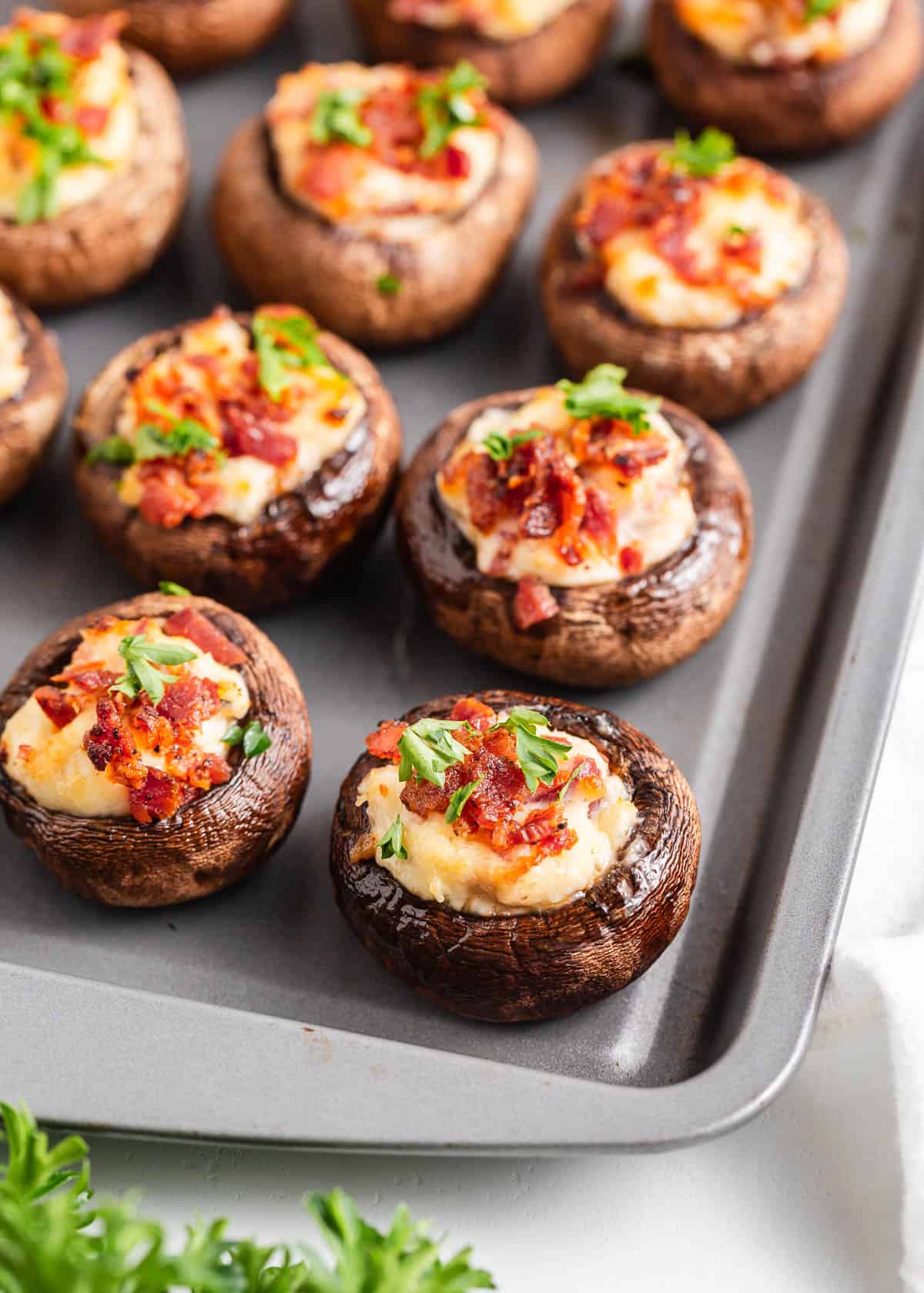 Stuffed mushrooms on a pan.