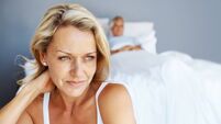 Man in bed with mature woman thinking