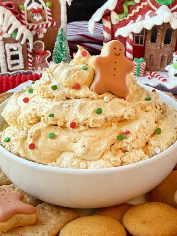 bowl of gingerbread dip with gingerbread man on top.