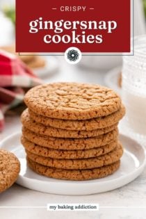 7 gingersnap cookies stacked on a white plate in front of a glass of milk. Text overlay includes recipe name.