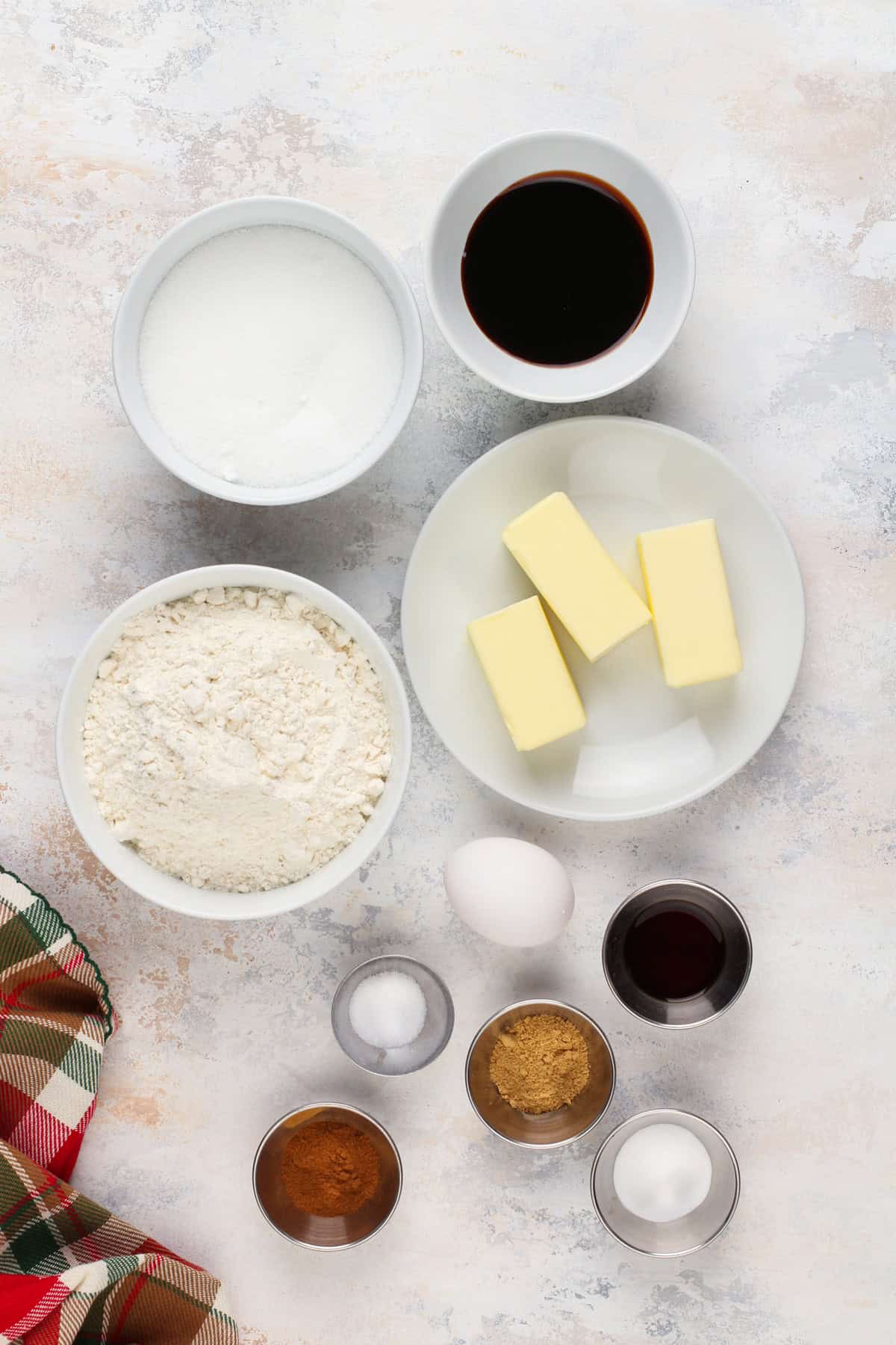 Ingredients for gingersnap cookies arranged on a countertop.