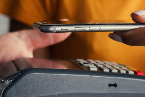 A women scanning her phone to make a payment