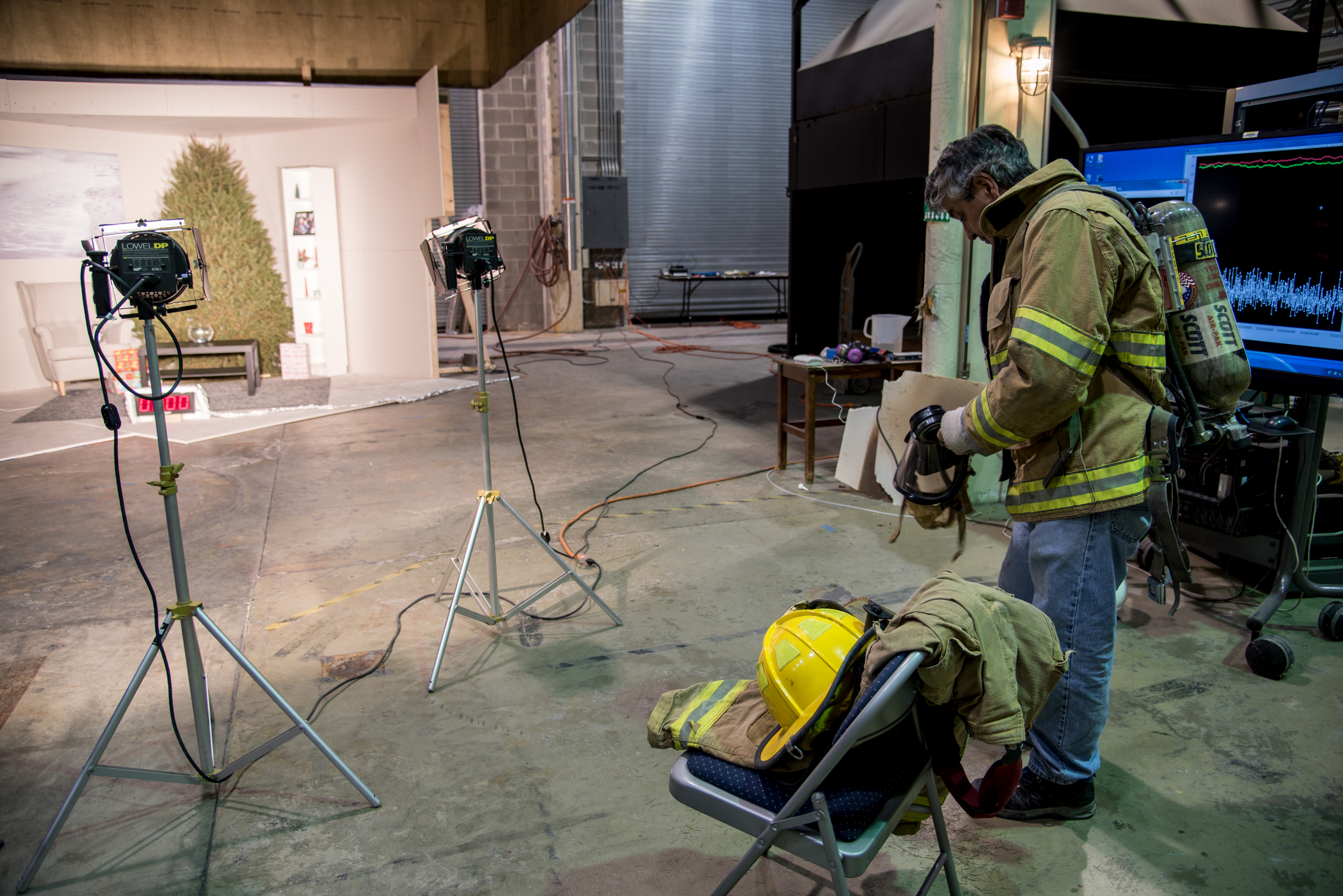 NIST Employee putting on his fire gear