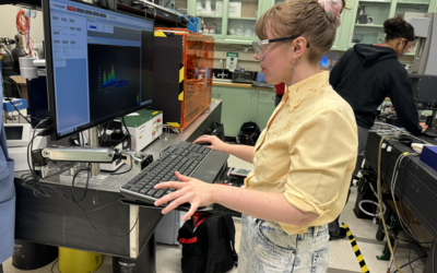 Julie Rieland, a researcher, looks at data on her computer screen in her lab.