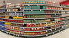 Fisheye view of grocery store shelves packed with coffee products.