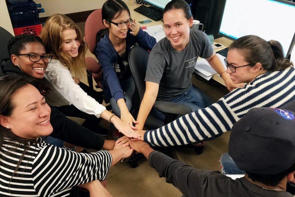 SCEC interns joining hands with Gaby Noriega