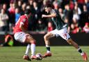 Bolton Wanderers' Aaron Collins competes with Wrexham's Matty James