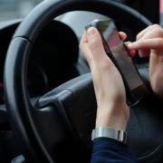 More than half of young drivers admit to illegal phone use while behind the wheel, a new survey indicates