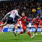 Klaidi Lolos heads the opening goal in the 3-1 win against Huddersfield in the Vertu Trophy