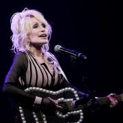 FILE – Dolly Parton performs during an event celebrating the Kansas statewide expansion of Dolly Parton’s Imagination Library in 2023 (AP Photo/Charlie Riedel, File)