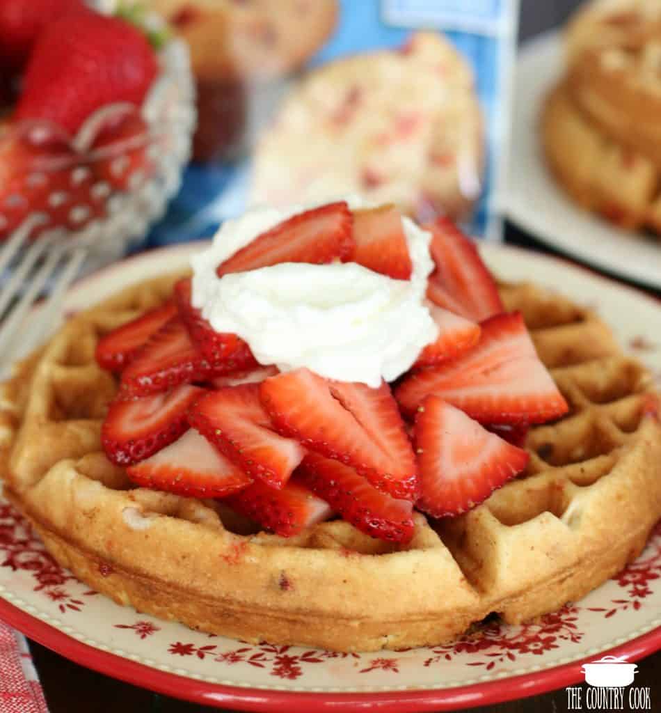 Strawberry Muffin Mix Belgian Waffles with macerated strawberries and whipped cream