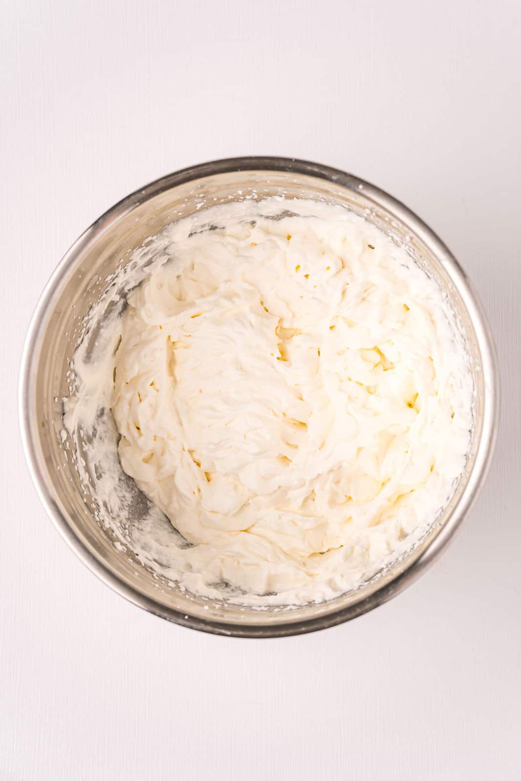 homemade whipped cream in a silver bowl.