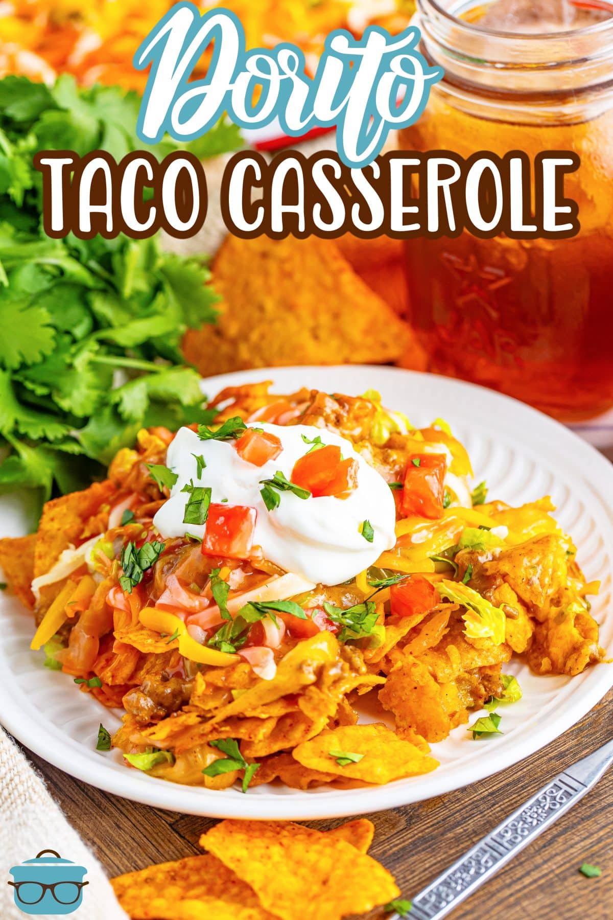 A white plate with a large serving of Dorito Taco Casserole.