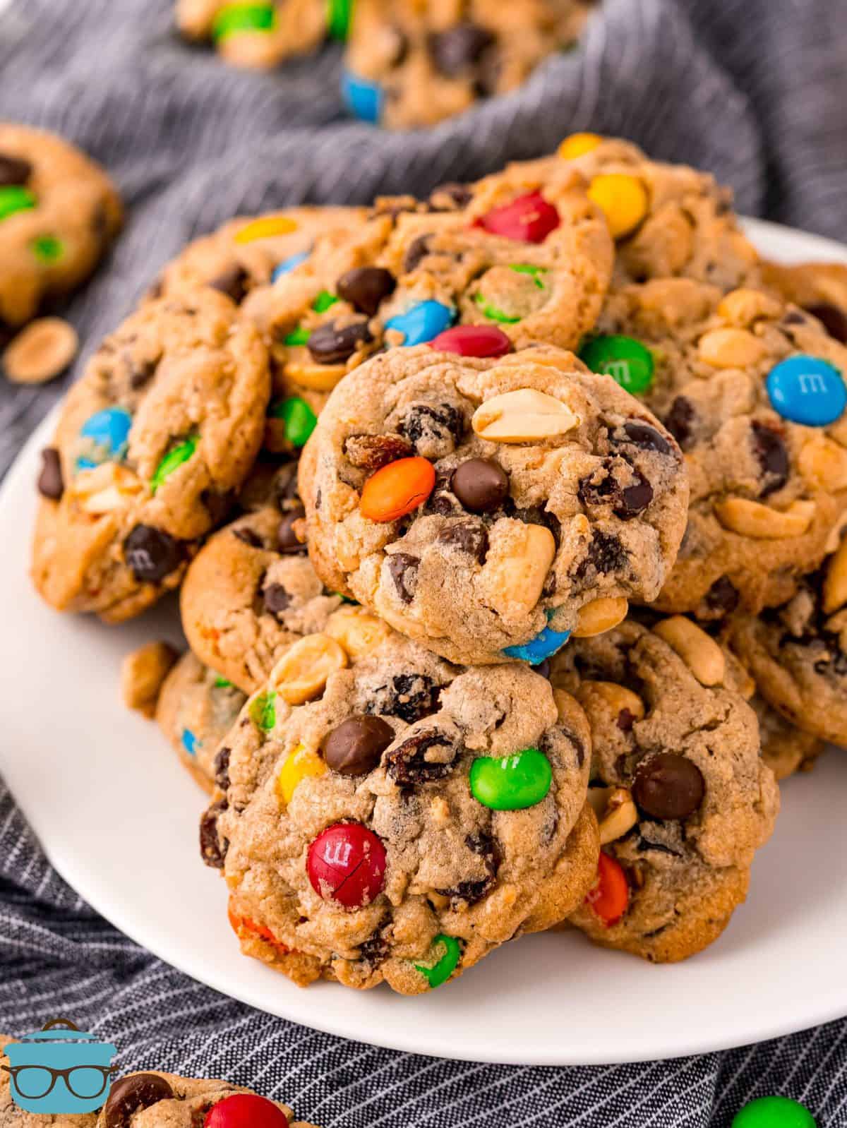 Trail Mix Cookies stacked on white plate.