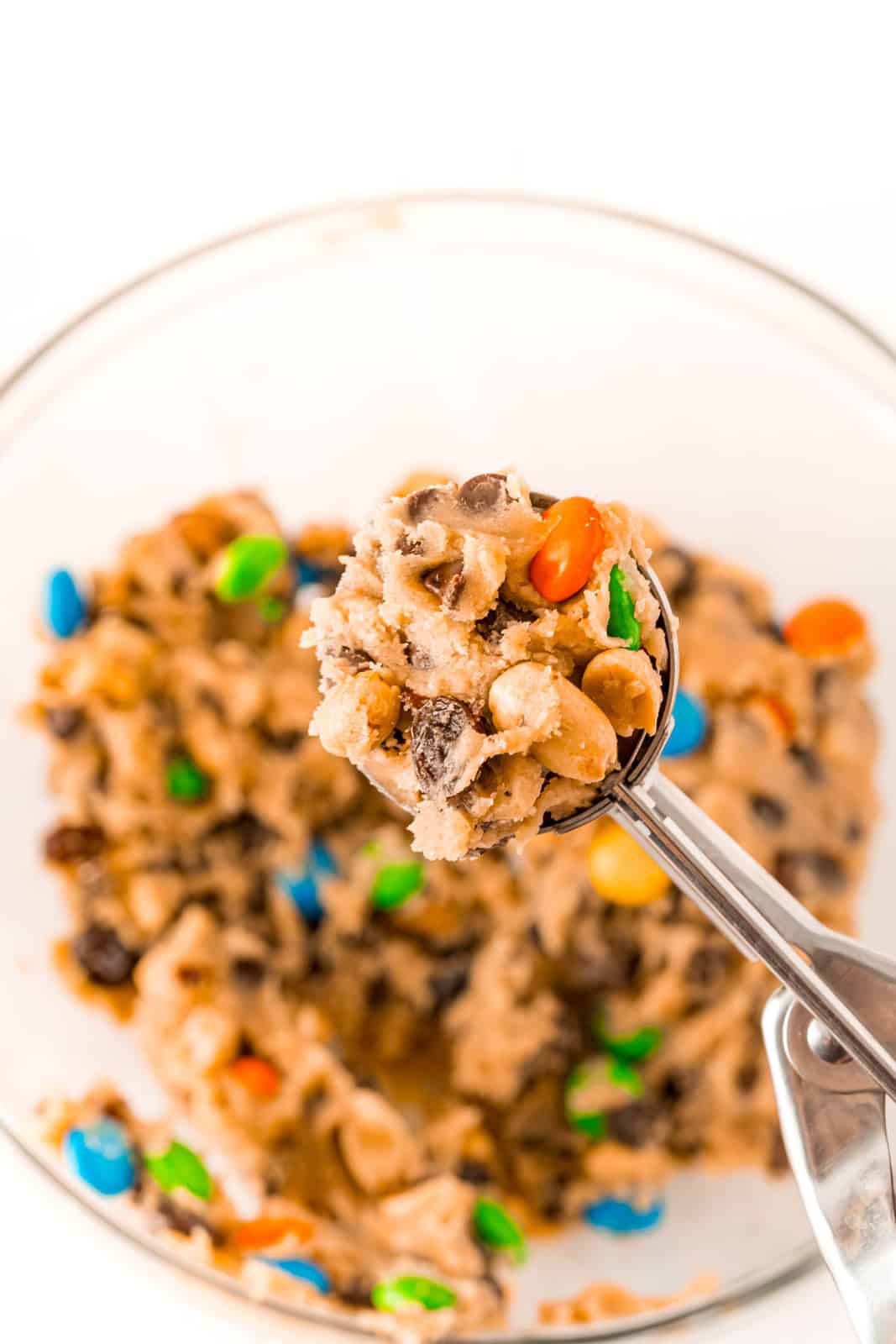 Cookie scoop holding full of cookie dough.