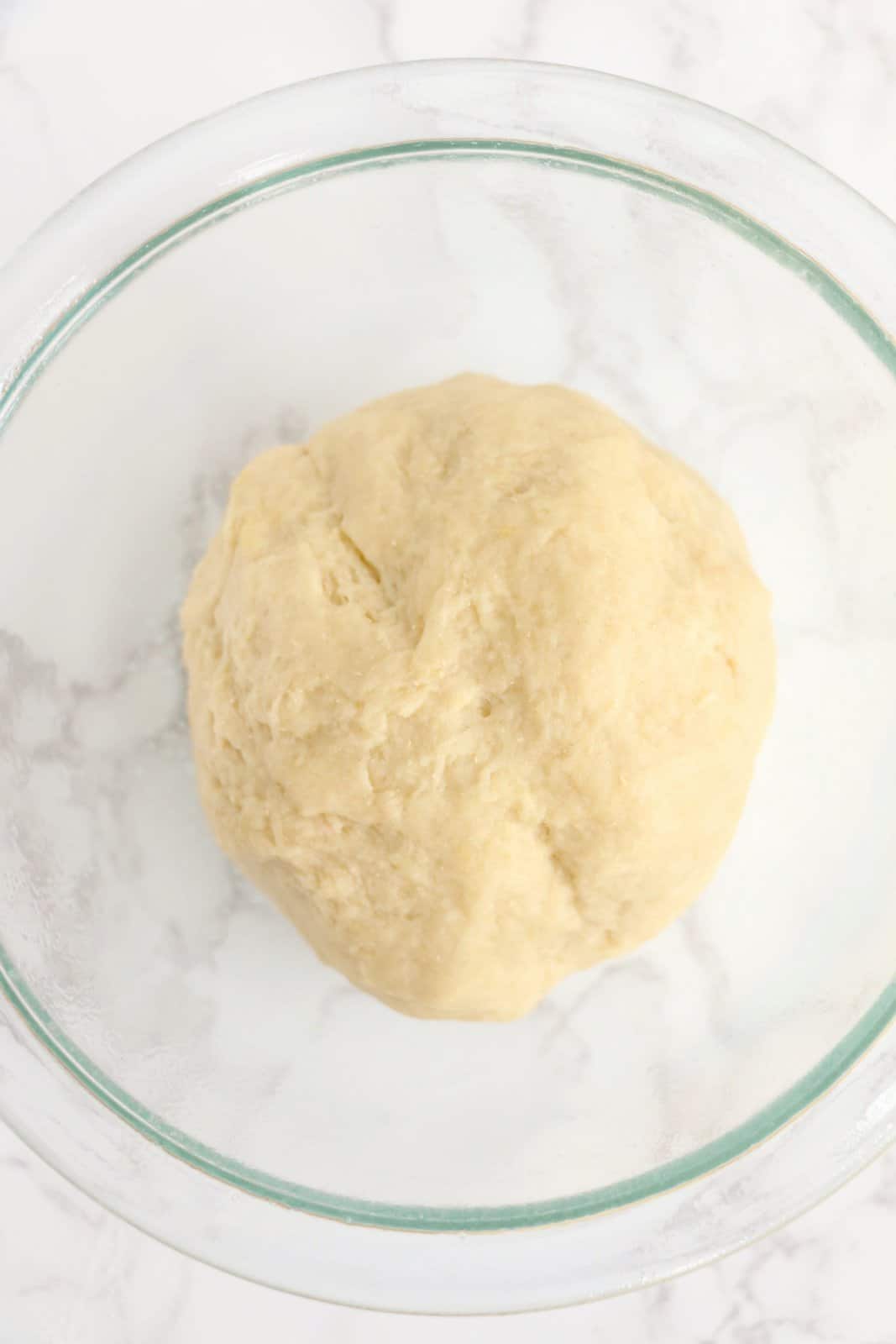 Finished dough in bowl resting.