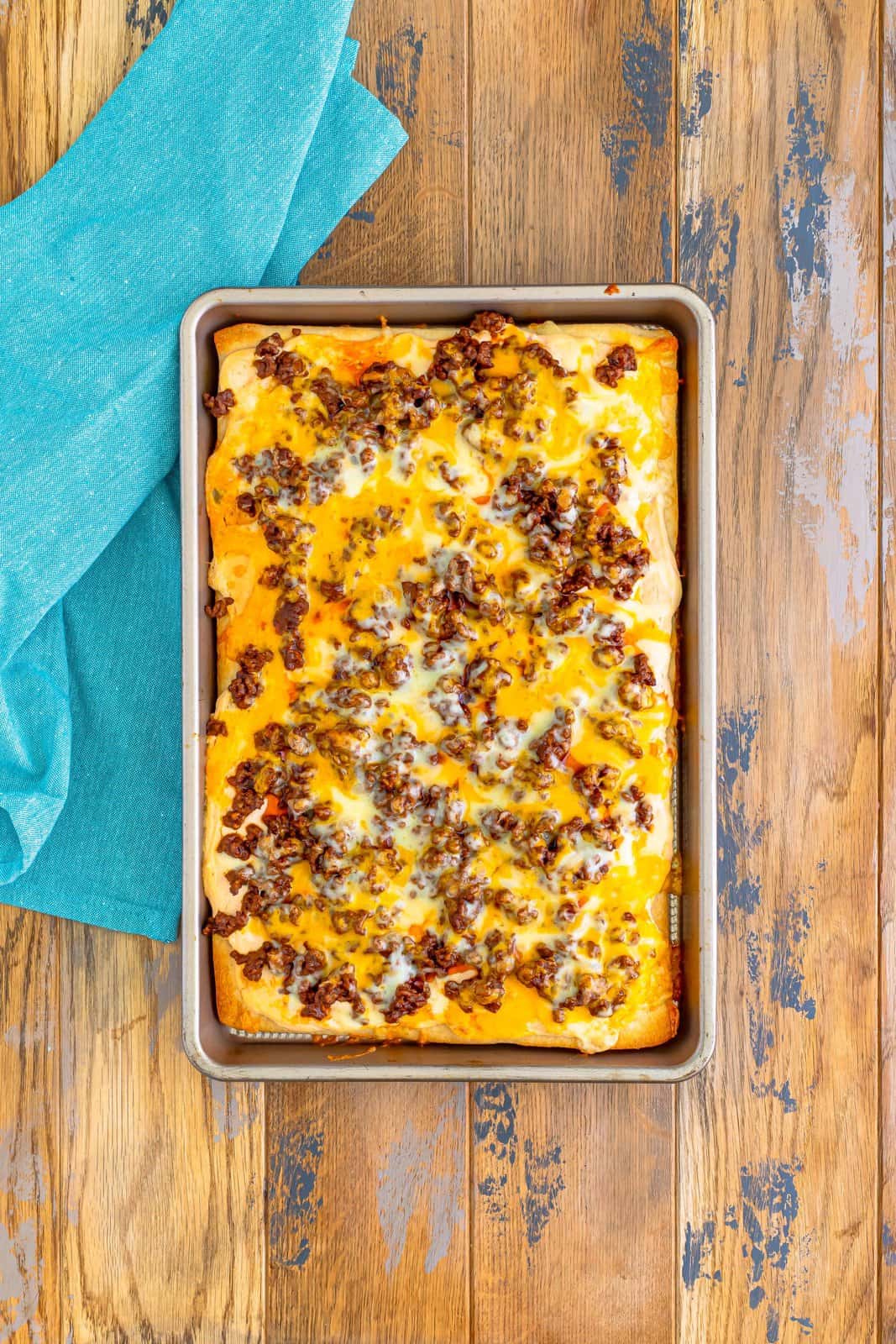 fully baked taco pizza (without toppings) straight out of the oven.