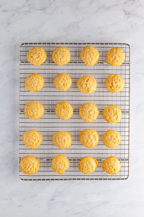 Fresh baked Potato Chip Cookies on a wire rack.