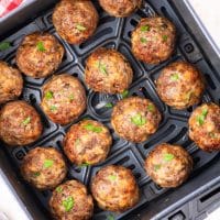 Looking down on an Air Fryer basket of Air Fryer Meatballs.