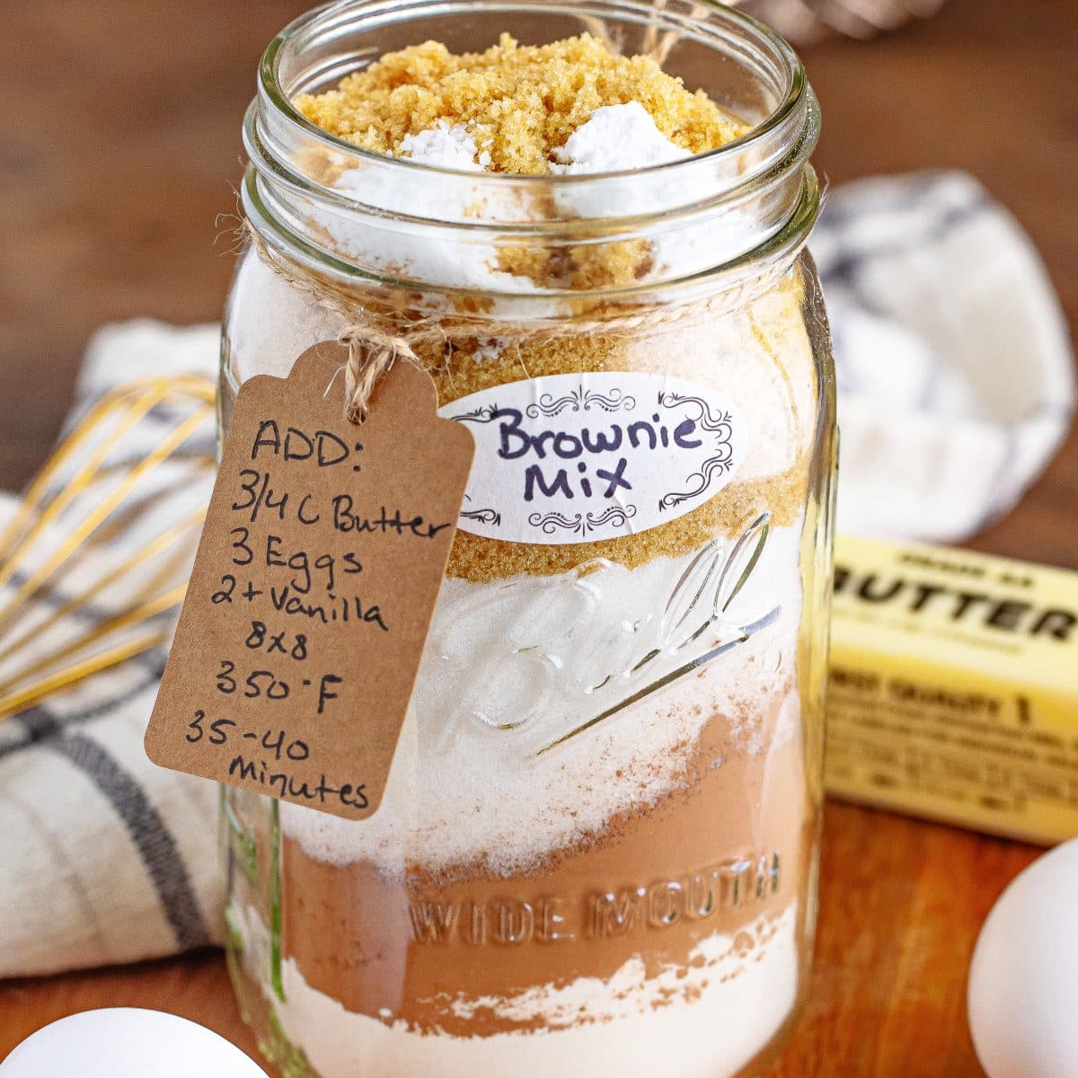 A jar of Homemade Brownie Mix with a tag and label.