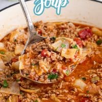 A pot of Cabbage Roll Soup with a ladle scooping some out.