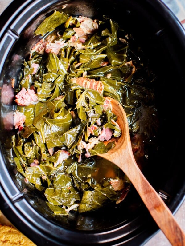 close up of collard greens with ham hocks.