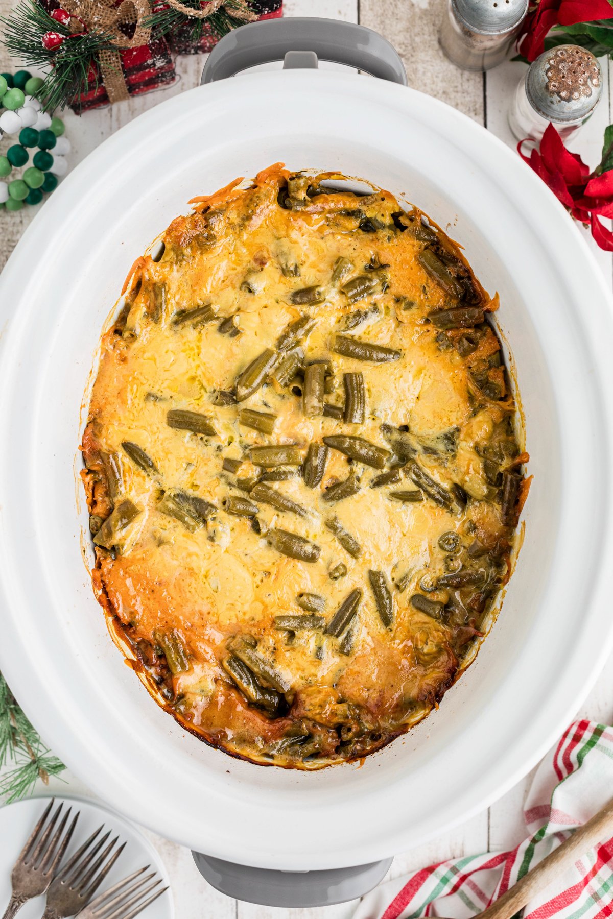 Christmas casserole with melted cheese in a crockpot.