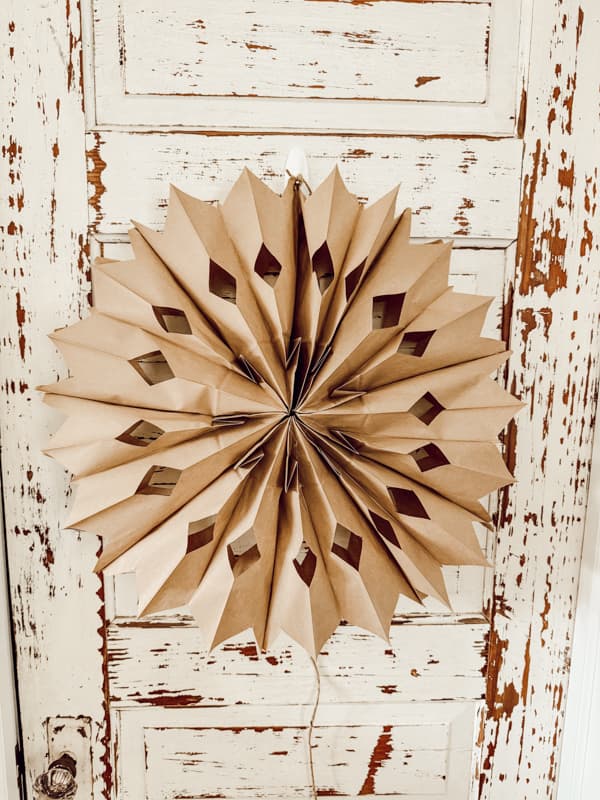 Brown kraft paper bag snowflake on vintage door