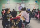 teacher and students in a classroom