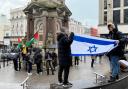 Pro-Israel and Pro-Palestine protesters facing off near the clock tower in centre Brighton.