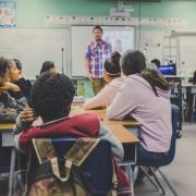 teacher and students in a classroom