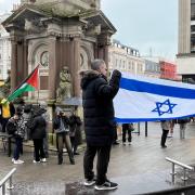 Pro-Israel and Pro-Palestine protesters facing off near the clock tower in centre Brighton.