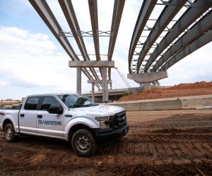 Truck under bridge