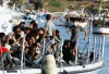 Migrants arriving on the island of Lampedusa.  The NATO-led invasion of Libya has opened a huge breach in Europe\